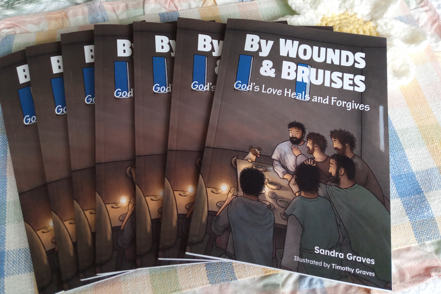 A photograph showing the covers of the first copies of By Wounds & Bruises